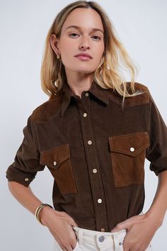 In 2021, Trish Wescoat Pound founded TWP to create the clothes she was constantly searching for. Each collection seamlessly merges meticulous tailoring, luxurious fabrications, and elegant details, offering a woman’s wardrobe of effortless ease and downtown sensibility.The Fudge and Tobacco Cowboy Take Me Away Shirt is a must-have in your closet. Going with the on-trend Western theme, this top features a two-tone design with a snap button placket, suede chest patch pockets, and a suede yoke. Style with wide leg denim or a floral maxi skirt and (of course) boots!
Collar
Long sleeves with snap button cuffs
Front snap button closure
Suede yoke
Front chest patch pockets with snap button closure
Relaxed fit
Material: 98% Cotton, 3% Elastane
Care: Dry clean Western Theme, Cocktail Attire, Floral Maxi Skirt, Weekend Wear, Night Looks, Wide Leg Denim, The Clothes, Pullover Sweatshirts, Floral Maxi