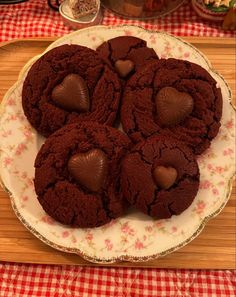 chocolate cookies on a plate with hearts in the middle