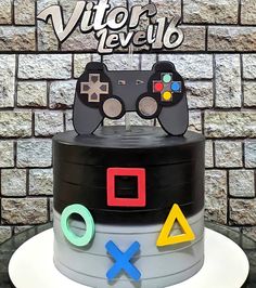 a birthday cake with video game controllers on top