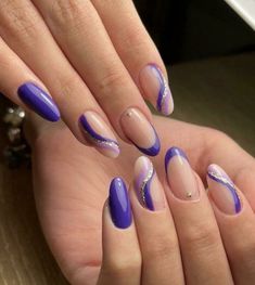 Elegant nail art with purple and gold accents on almond-shaped nails. Long Nail Art, Tie Dye Nails, Galaxy Nails, Painted Nail Art