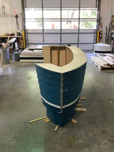 a boat is being built in a garage