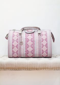 The Dewi Weekender Bag in Pink and White. Available at Kadou Boutique. Travel Bag With Top Carry Handle For Trips, Luxury Tote Weekender Bag For Trip, Luxury Weekender Bag With Top Carry Handle For Trips, Traditional Tote Weekender Bag For Travel, Pink Weekender Bag With Zipper For Travel, Luxury Embroidered Travel Bags, Traditional Pink Travel Bag, Everyday Pink Weekender Bag With Double Handle, Pink Functional Weekender Bag With Adjustable Strap