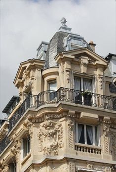 an ornate building with balcony and balconies