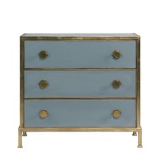 a blue and gold dresser with three drawers