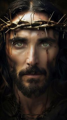 the face of jesus with crown of thorns on his head and nails all around him