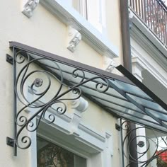 an iron balcony railing on the outside of a house