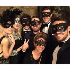 a group of people wearing masks and posing for a photo on the facebook page, with one man in a tuxedo