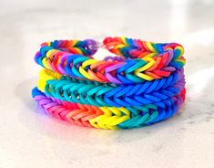 This listing is for a 3 pack of Rainbow Fishtail Bracelets. There are 3 Separate Styles: Thin Stripe, Thick Stripe and Mega Stripe. You will get one of each style for a total of 3 bracelets.  These bracelets are made with love and care individually by the boys who started Boys Bracelet Business.  10% of all sales are donated to Riley Children's Foundation.  Colors may vary. Due to computer monitors displaying colors differently and everyone can see these colors differently, we cannot guarantee that the color you see on your screen accurately portrays the true color of the product you'll receive Bracelet Boys, Boys Bracelet, Fishtail Bracelet, Bracelet Business, Boys Bracelets, Business Colors, Foundation Colors, Rainbow Bracelet, Handmade Bracelet