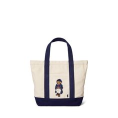 Rendered in durable cotton canvas with a top zip closure this tote bag is embroidered with two Ralph Lauren icons—our signature Pony and the Polo Bear. Ralph Lauren Teddy Bear Bag, Ralph Lauren Coffee Tote Bag, Ralph Lauren Reversible Tote, Bear Canvas, Ralph Lauren Tote, Canvas Small, Xmas List, 2024 Christmas, Polo Bear