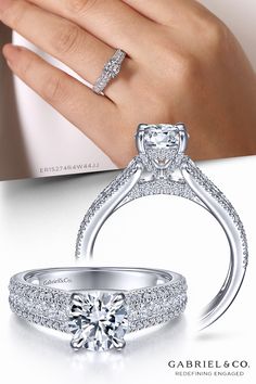 a woman's hand holding an engagement ring with two diamonds on it and the words,