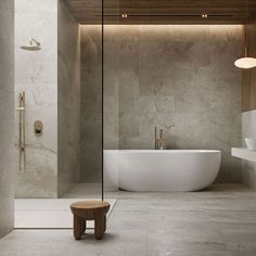 a bathroom with a large white tub next to a walk in shower and a wooden stool