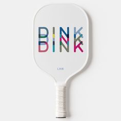 a ping pong paddle with the word pink printed on it's back side