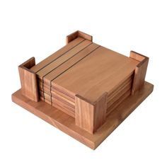 a wooden tray with four pieces of wood on it