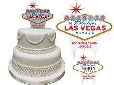 a wedding cake with the las vegas sign in the background and decorations for each piece