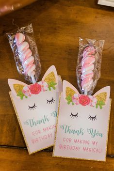 two unicorn shaped candy bags with thank you for making my birthday magic