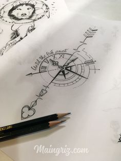 a pencil is sitting on top of some paper with drawings and writing in the background