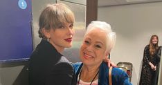 two women hugging each other in an office