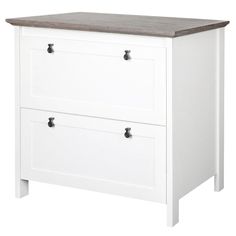 a white dresser with two drawers on one side and an oak top drawer on the other