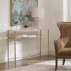 a living room scene with focus on the table and chair, which is decorated in gold