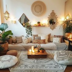 a living room filled with lots of furniture and candles on top of it's coffee table