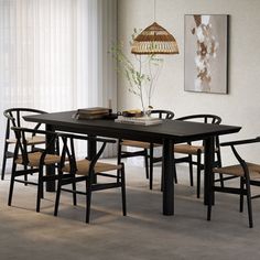 a dining table with six chairs and a lamp