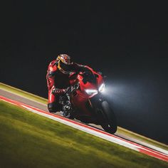 a person riding a motorcycle on a race track