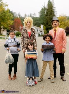 the family is dressed up in costumes for halloween