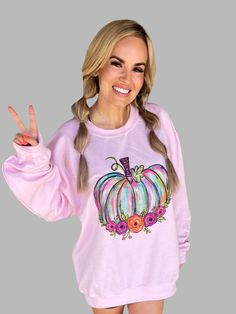 Get ready for pumpkin season with our Bright Pumpkin Crewneck! Made with high-quality, comfortable material, this crewneck is perfect for chilly fall days. The bright pumpkin design adds a fun pop of color to your wardrobe. Stay cozy and stylish all season long with this must-have crewneck! Gildan 18000- Light Pink 50/50 cotton/polyester Unisex: TTS Fit Sublimation Printed Casual Sweater With Graphic Print For Fall, Trendy Pink Fall Sweatshirt, Trendy Pink Sweatshirt For Fall, Trendy Long Sleeve Fall Sweatshirt, Trendy Long Sleeve Sweatshirt For Fall, Fall Graphic Print Crew Neck Sweater, Fall Graphic Print Long Sleeve Sweatshirt, Fall Crew Neck Sweater With Graphic Print, Purple Graphic Print Sweatshirt For Fall