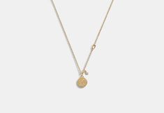 Plated brass glass and cubic zirconia Lobster clasp closure Pendant: 1/4 (L) x 1/4 (H) Adjustable 16 - 18 (L) Style No. CO746 Coin Pendant Necklace, Coach Outlet, Brass Glass, Wallet Shop, Coin Pendant, Metallic Leather, Accessories Shop, 4 H, Lobster Clasp