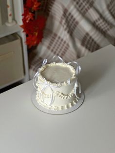 a white cake sitting on top of a table