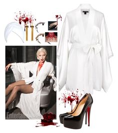 a woman in white robe and high heel shoes with blood on the floor next to her