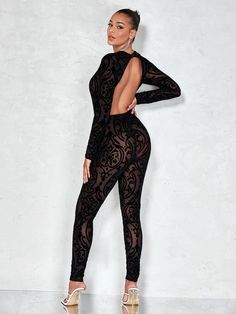 Be the life of the party in this sassy, sheer Damask Print Mesh Unitard Jumpsuit! This jumpsuit is made of soft and lightweight mesh, giving you proper comfort no matter how active you get. The elastane blend offers easy fit and flexibility for a broad range of movement. With a black damask print and backless design, you'll make an unforgettable statement in this show-stopping ensemble. Be ready to turn heads. Specifications: Color: Black Neckline: Round Neck Pattern Type: Floral Sleeve Length: Long Sleeve Details: Sheer Length: Long Sleeve Type: Regular Sleeve Fabric: Medium Stretch Material: Knitted Fabric Composition: 70% Polyester, 28% Polyamide, 2% Elastane Care Instructions: Hand wash,do not dry clean Body: Lined Sheer: No Size Chart(cm): Size Bicep Length Bust Cuff Hip Size Inseam L Fitted Mesh Bodysuit For Party, Fitted Party Bodysuit With Mesh Back, Fitted Bodysuit With Mesh Back For Party, Elegant Long Sleeve Party Unitard, Party Bodysuit With Mesh Sleeves And Stretch, Party Bodysuit With Mesh Sleeves, Stretch Bodysuit With Mesh Sleeves For Party, Backless Stretch Bodysuit For Party, Sheer High Stretch Bodysuit For Night Out