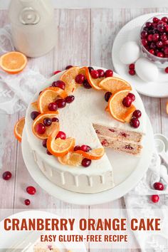 a cake with orange slices and cranberries on top is shown in the foreground