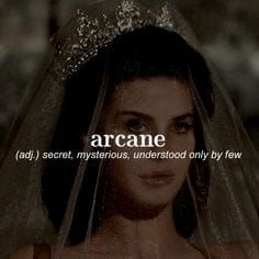 a woman wearing a veil with the words arcane above her head and underneath her veil