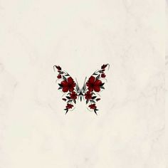 a butterfly with red flowers on it's wings is flying through the air in front of a white background