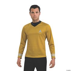 a man in a star trek uniform standing with his hands on his hips and looking at the camera