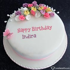 a birthday cake with flowers and butterflies on the top that says happy birthday dikijaan