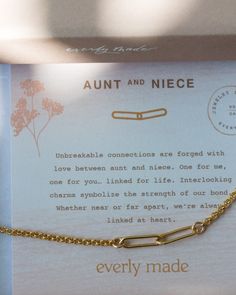 an open box with a gold necklace on it's front and back side that says, every made