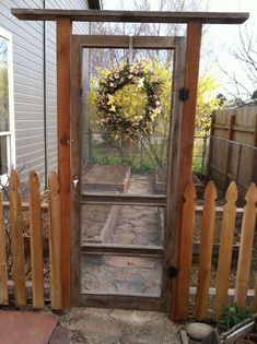 an open door with a wreath on it