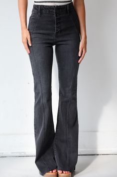 Elevate your denim game with the Zoey Black Flare Jeans, a perfect fusion of sophistication and retro flair! Designed to flatter and enhance your silhouette, these jeans are a chic and versatile addition to any wardrobe. Crafted from high-quality, stretchy black denim, these jeans feature a high-rise waist that provides a flattering fit while elongating your legs. The sleek black hue offers a streamlined and polished look, making these jeans easy to dress up or down for any occasion. The flare l Chic Wide Leg Washed Black Flare Jeans, Chic Wide Leg Flare Jeans In Washed Black, Edgy Black Flare Jeans For Fall, Edgy Medium Wash Jeans For Fall, Chic Dark Wash Full-length Jeans, Black Flared Bottoms With Pockets, Black Flare Bottoms With Pockets, Black Stretch Straight Leg Flare Jeans, Black Stretch Flare Jeans With Straight Leg