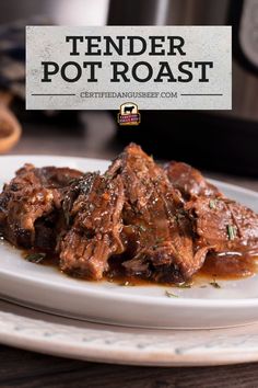 the tender pot roast is served on a white plate