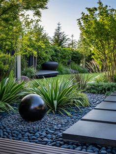 an outdoor garden with rocks and plants