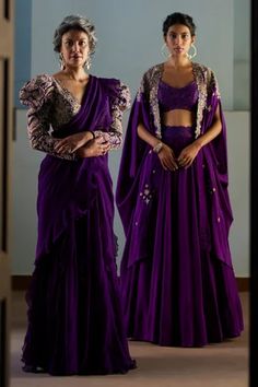 Shop for Mrunalini Rao Purple Pure Silk Paisley Embroidered Cape Lehenga Set for Women Online at Aza Fashions Traditional Drape Choli For Formal Occasions, Fitted Cape Set With Dupatta, Saree With Zari Work And Cape Sleeves, Silk Unstitched Blouse With Cape Sleeves, Festive Formal Lehenga With Cape Sleeves, Transitional Designer Gown, Formal Lehenga With Cutdana Detailing, Anarkali Style Pre-draped Saree With Cape Sleeves, Fitted Gown With Zari Work And Cape Sleeves