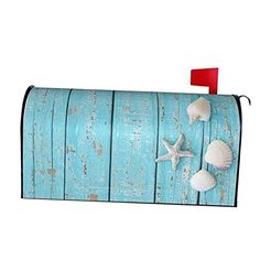 a blue mailbox with three seashells on it