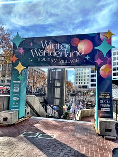 the entrance to winter wonderland is decorated with stars and confetti on it's side