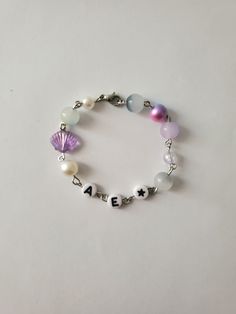 Decorative Aespa bracelet with handpicked beads and unique charms. Your new favorite fan accessory designed to capture the essence of Aespa. Freebies included. Aespa Accessories, Aespa Bracelet, Fan Bracelet, Fan Accessories, Bridesmaid Accessories, Mode Kpop, Jewelry Inspo, Kpop Fashion, Gift Accessories