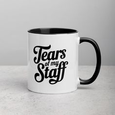 a black and white coffee mug with the words tears or my staff printed on it