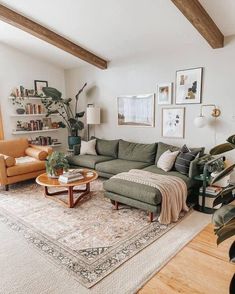 a living room filled with furniture and lots of plants on top of a wooden floor