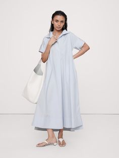 We reimagined the timeless kaftan silhouette with wide sleeves and slits at the side hem to show a little leg.  Here, we've cut this dress in our signature cotton poplin.  Relaxed fit with dropped shoulder.  Long, wide sleeves.  Deep v-neck with collar.  On-seam pockets.  Straight hem with high, side slits.  Unlined.  *This dress runs oversized.  Consider sizing down.  Relaxed fit.  Short sleeves.  Maxi length.  Model: Size S, 5'10" (178cm).  *This dress runs oversized.  Consider sizing down. New Frock, Royal Blue Maxi Dress, Flounce Hem Dress, Maxi Shirt Dress, Maxi Slip Dress, Blue Maxi, Striped Maxi Dresses, Banana Republic Dress, Midi Maxi Dress