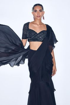 Black pre draped ruffle saree in a solid base. Comes with padded cutdana embroidered blouse. - Aza Fashions Party Blouse With Pre-draped Sleeves, Pre-draped Blouse With Draped Sleeves For Party, Evening Georgette Blouse Piece With Ruffles, Evening Georgette Blouse With Ruffles, Festive Ruffled Blouse For Evening, Party Georgette Draped Blouse, Black Draped Blouse For Evening, Elegant Draped Ruffle Blouse, Fitted Draped Blouse With Ruffles